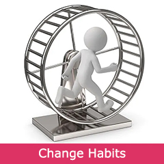 A man walking inside a hamster wheel before his hypnosis session to break bad habits.
